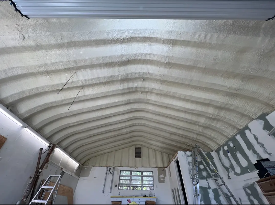 Spray polyurethane foam applied to the underside of a metal roof deck in Spokane Valley